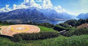 Scenic helipad view in the mountains near a lake, highlighting Helipaddy for helicopter landing spots.