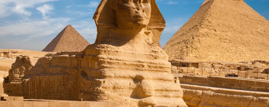 A beautiful profile of the Great Sphinx including the pyramids of Menkaure and Khafre in the background in Giza, Cairo, Egypt