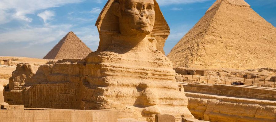 A beautiful profile of the Great Sphinx including the pyramids of Menkaure and Khafre in the background in Giza, Cairo, Egypt