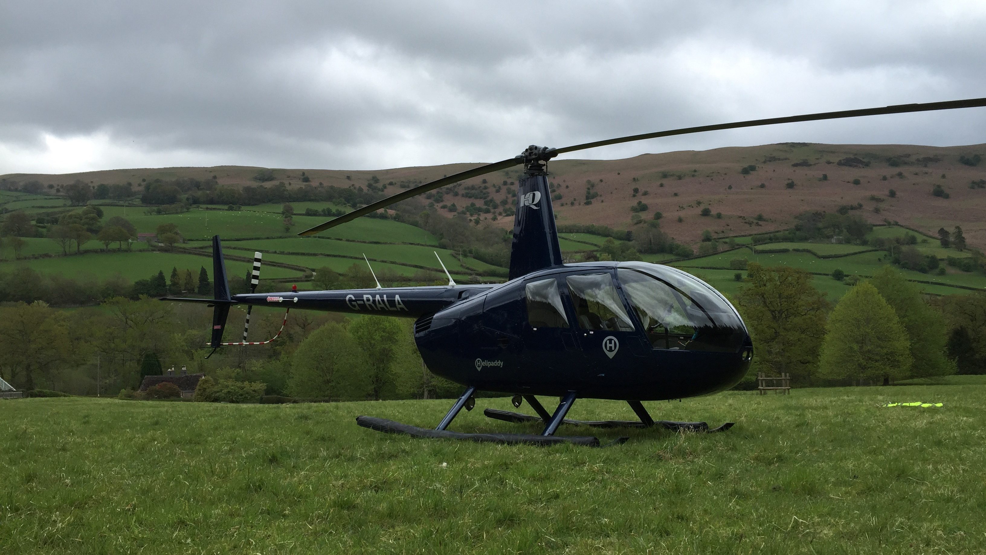 Robinson R44 helicopter on a hill 
