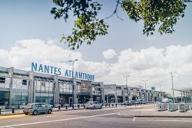 Nantes Atlantique Airport exterior view on a sunny day, accessible via Helipaddy for convenient helicopter landings.