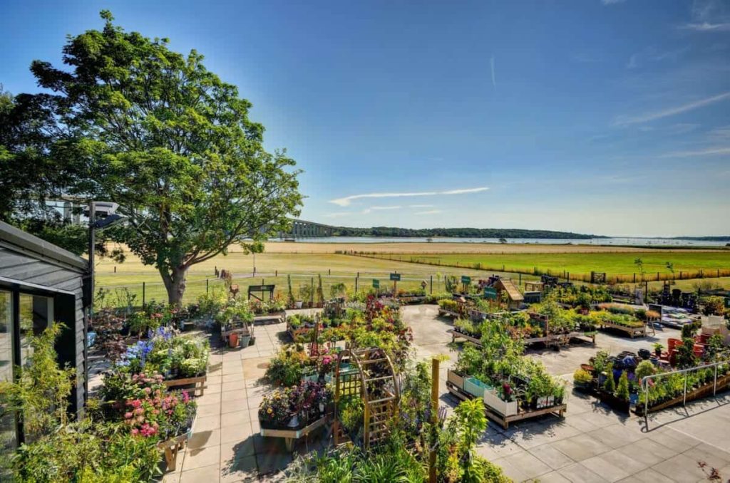 Lush garden and scenic landscape with a clear blue sky, associated with Helipaddy landing site.