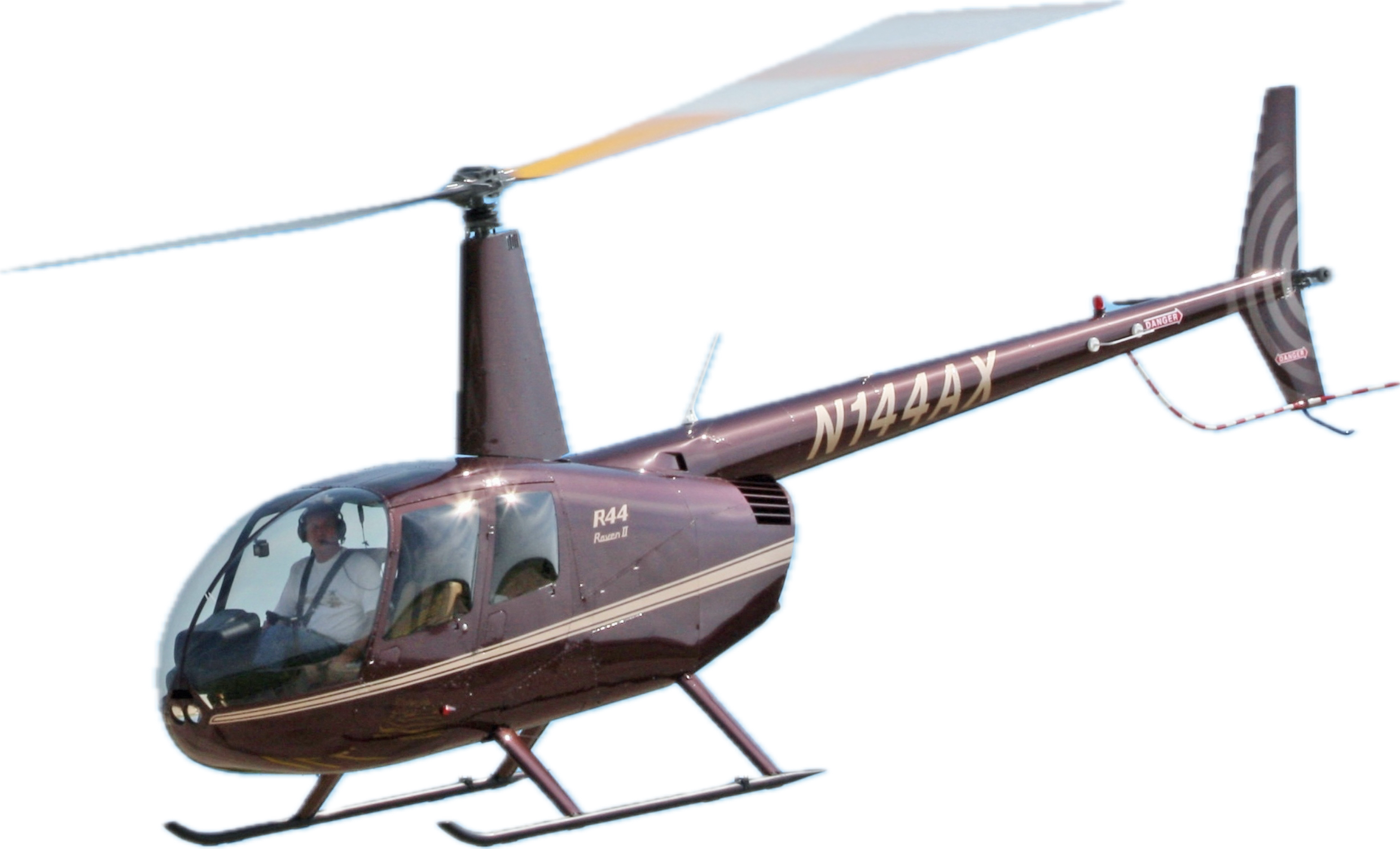 Robinson R44 helicopter in flight, associated with Helipaddy landing site platform.