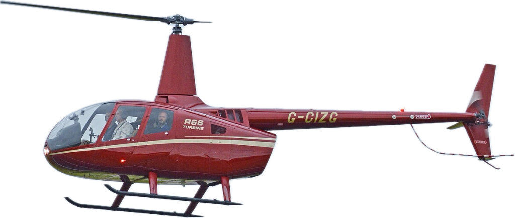 Red Robinson R66 helicopter in flight, showcasing Helipaddy services for helicopter landing locations.