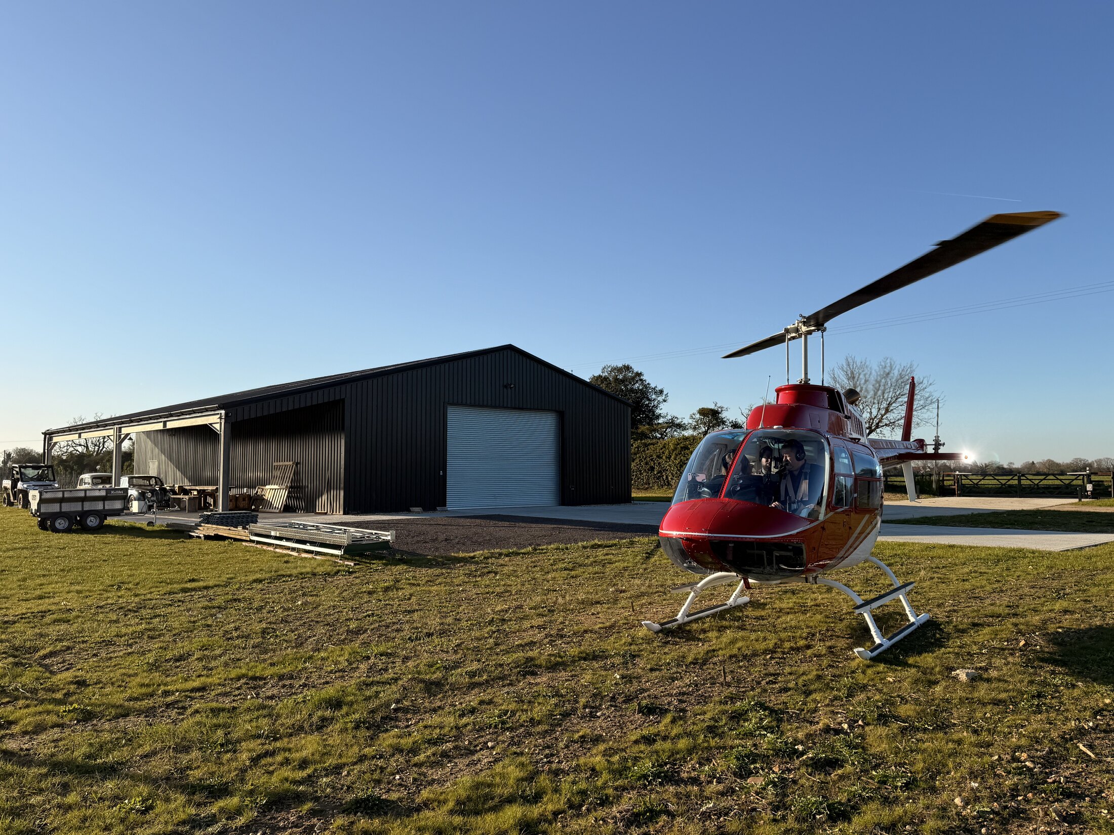 Andy Thompson arriving by red Bell helicopter for the Cloud Lift service visit