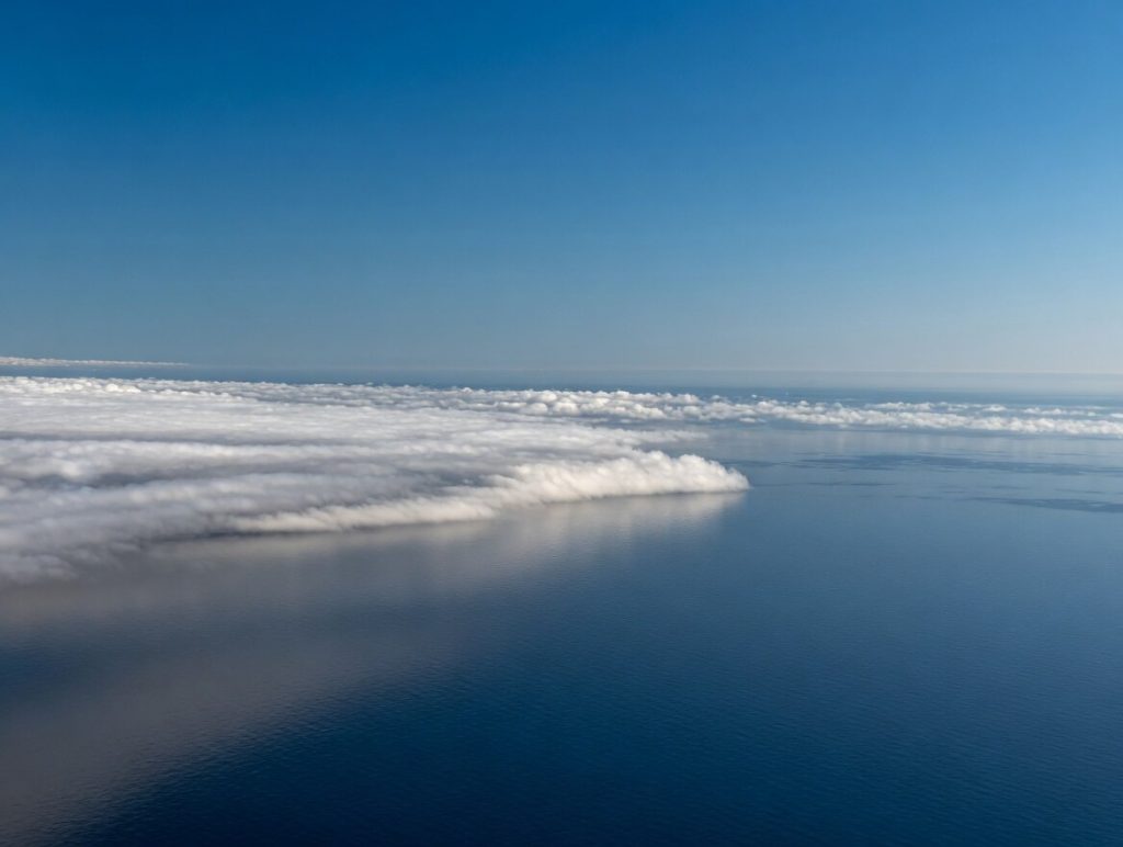 Cloud layer reaching the sea near Genoa during the return flight